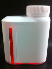 The bottle emits red light, and also chimes and the patient is contacted by phone, after a dose is missed