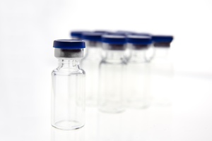 Addressing glass particulates in injectable drug formulations