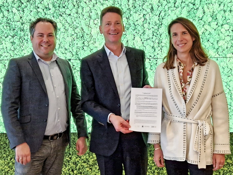 CordenPharma CEO Dr Michael Quirmbach (middle) and Corporate Safety, Health & Environment Manager Tobias Patommel (left) join Judith Charpentier, Partner, Head of Healthcare Investing at Astorg (right) to present a signed 
