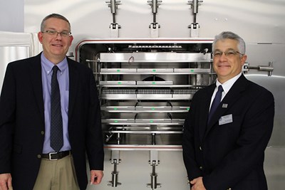 The LyoBay's high-capacity freeze-dryer. (L–R): William Kessler, VP of applied optics at Physical Sciences; Thomas Ferraguto, Director of UMass Lowell’s Nanofabrication Lab, and (PSI)
