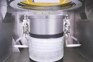 Discharger dust hood contains bag spout leaks