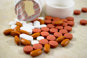 Induction cap sealing in tamper-evident packaging