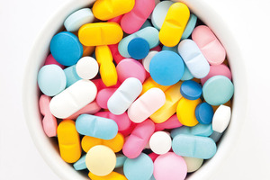 Optimising coating process parameters and formulation concepts for functional taste-masking during continuous manufacturing  