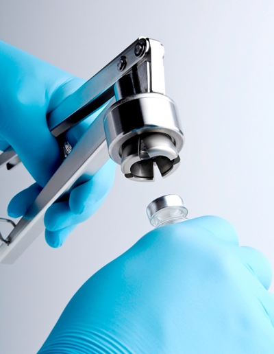 Stainless steel crimper provides secure vial closure